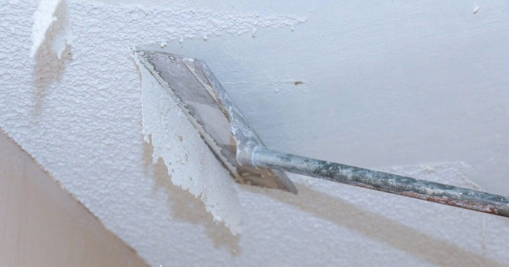 when did they stop using asbestos in popcorn ceilings